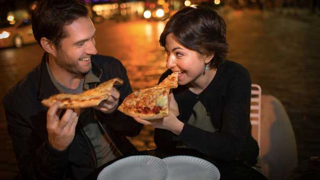 Couple eating pizza