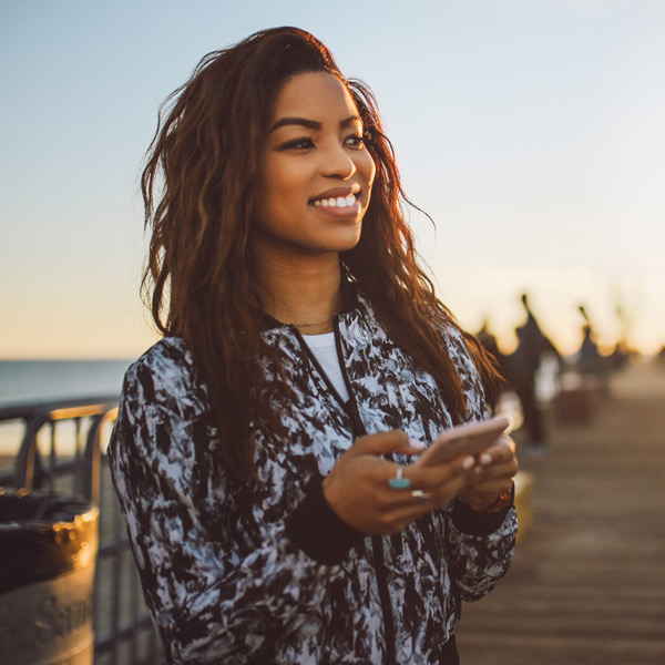 woman on her phone smiling