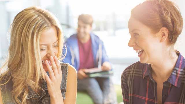 2 girls talking and laughing