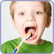 Small boy brushing his teeth