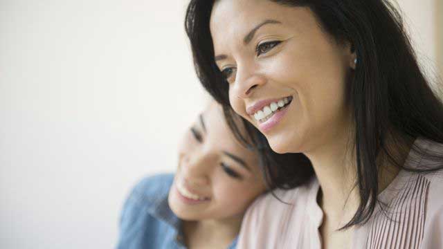 Mother and child smiling