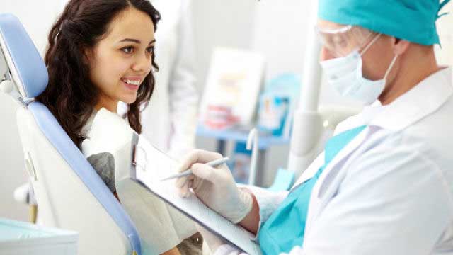 Girl sitting in the dentist's clinic