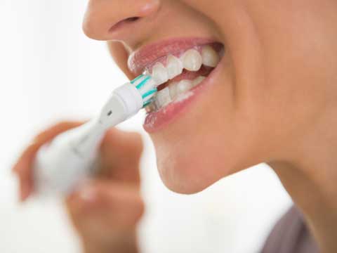 Woman brushing her teeth